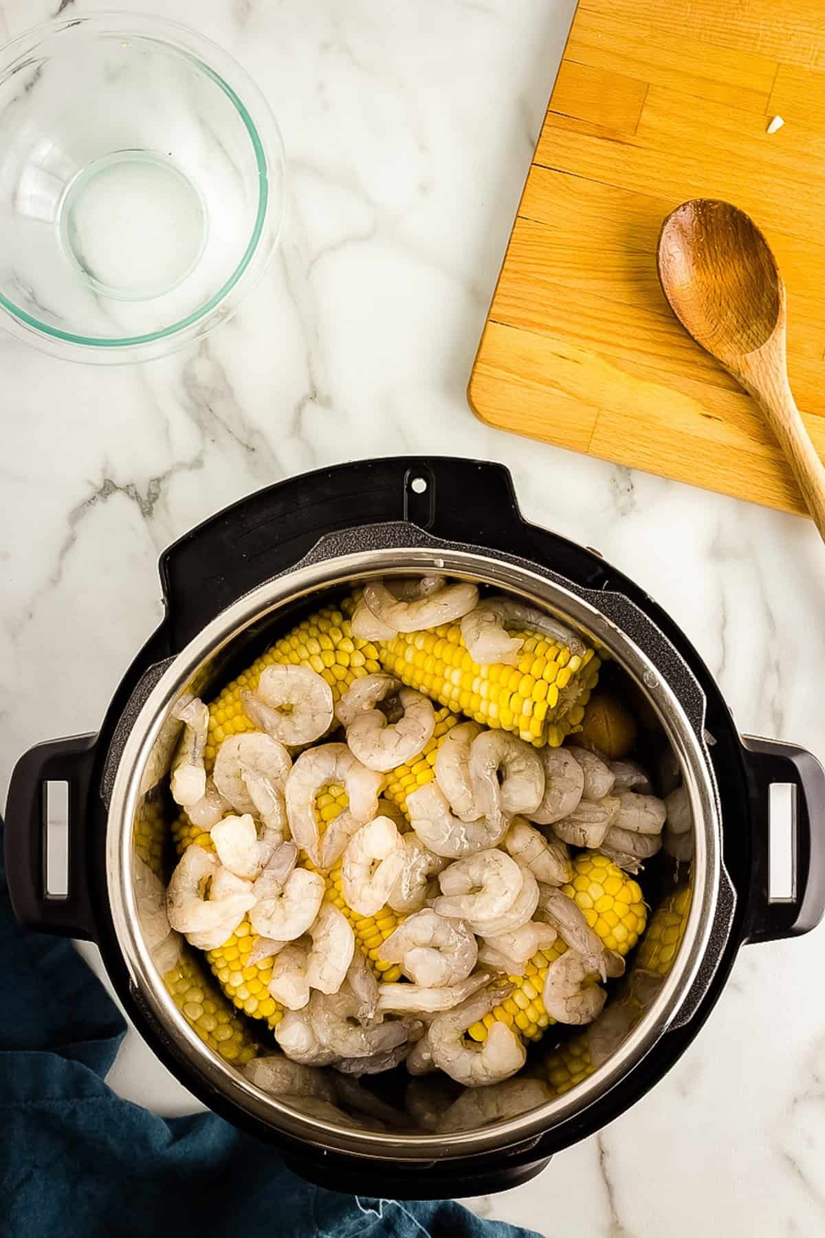 Raw shrimp in Instant Pot with Shrimp boil ingredients