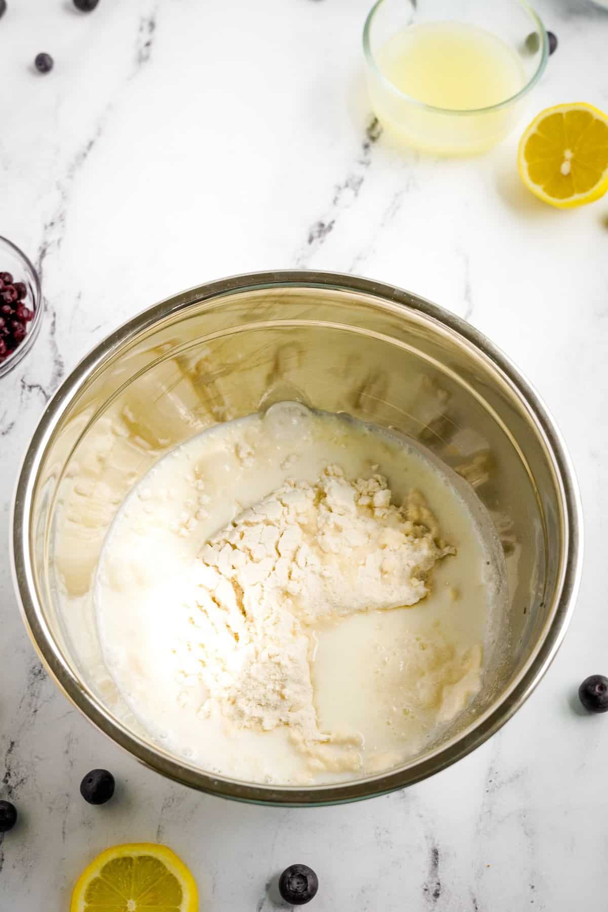 ingredients in bowl for lemon blueberry bread