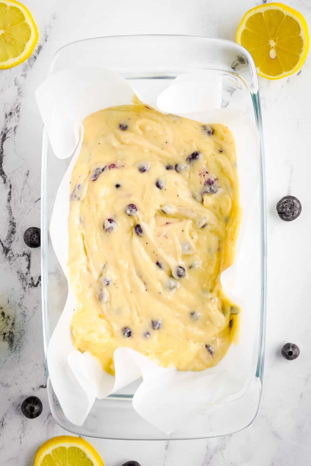 Loaf pan with blueberry bread batter
