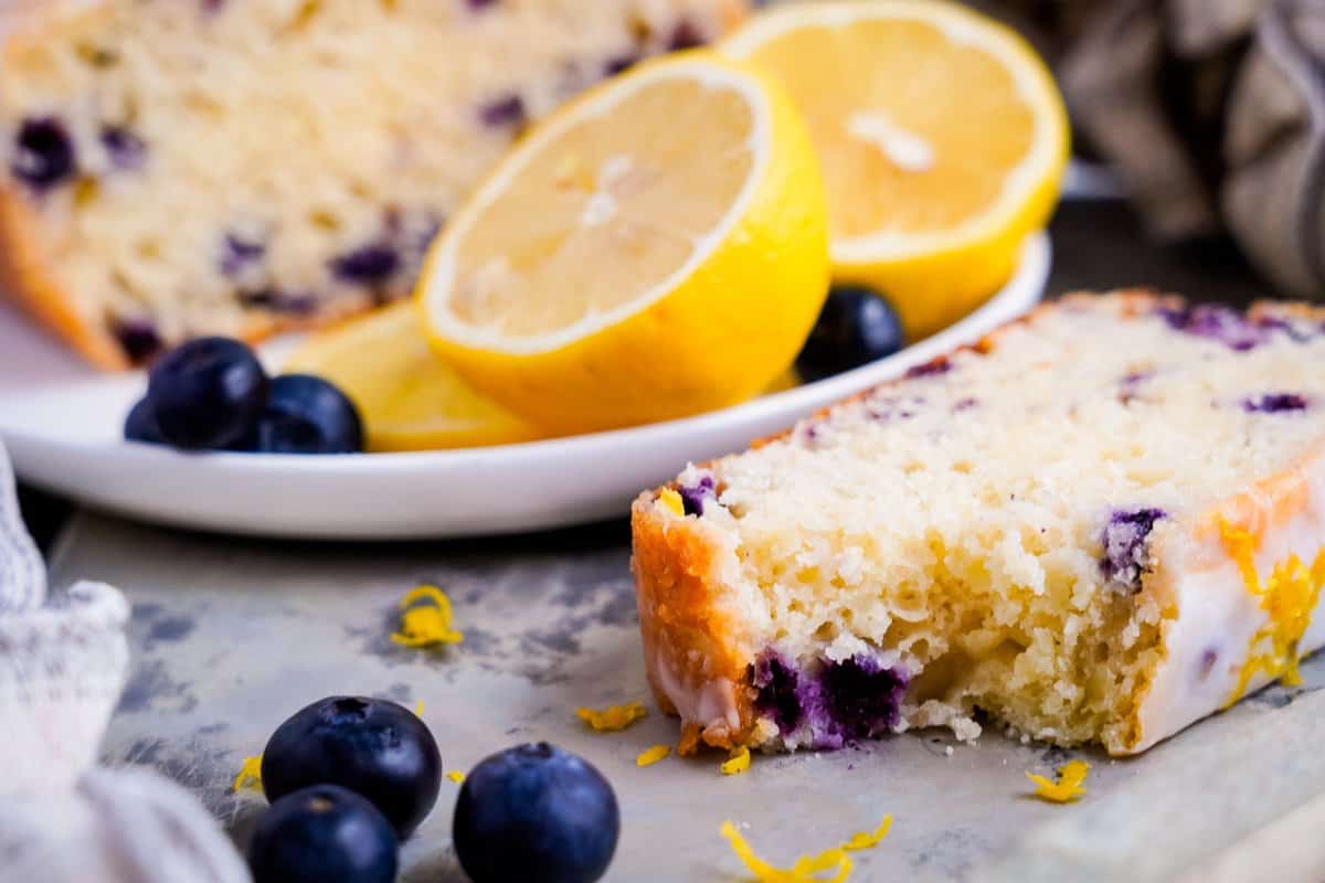 Lemon Blueberry Loaf slice with a bite out of it