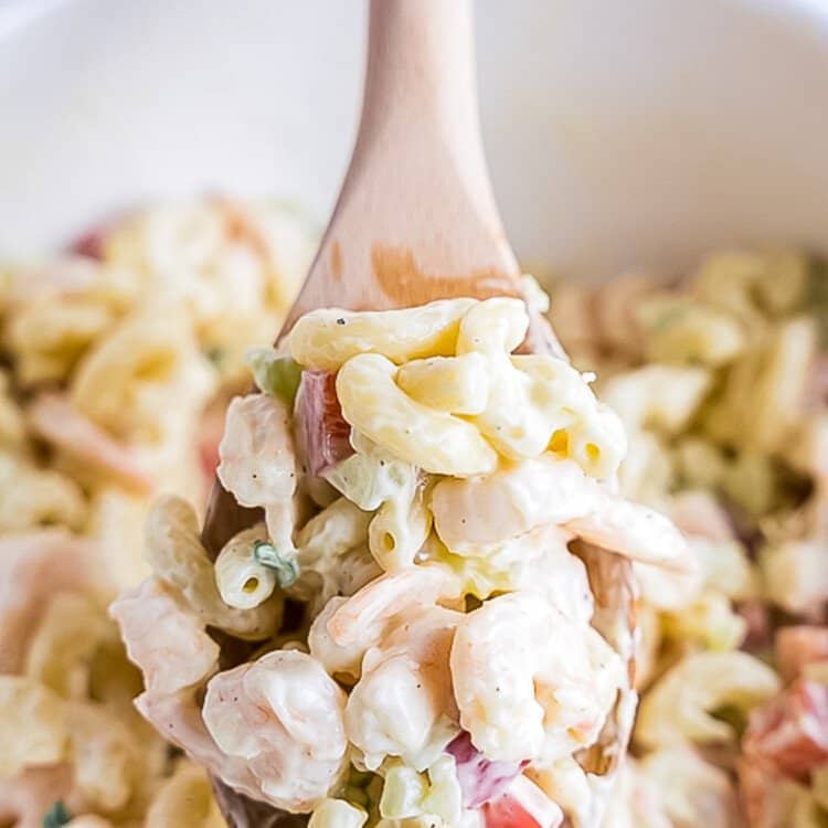 Bowl with Shrimp Pasta Salad and wooden spoons