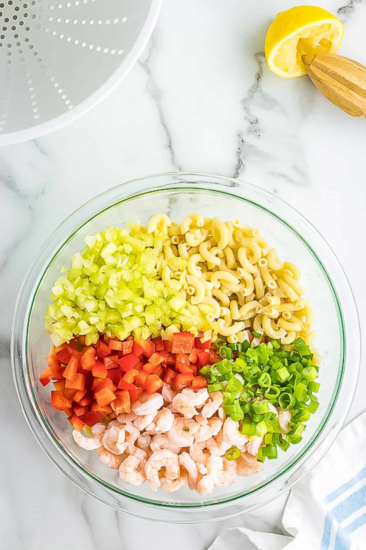 Ingredients for shrimp pasta salad in bowl