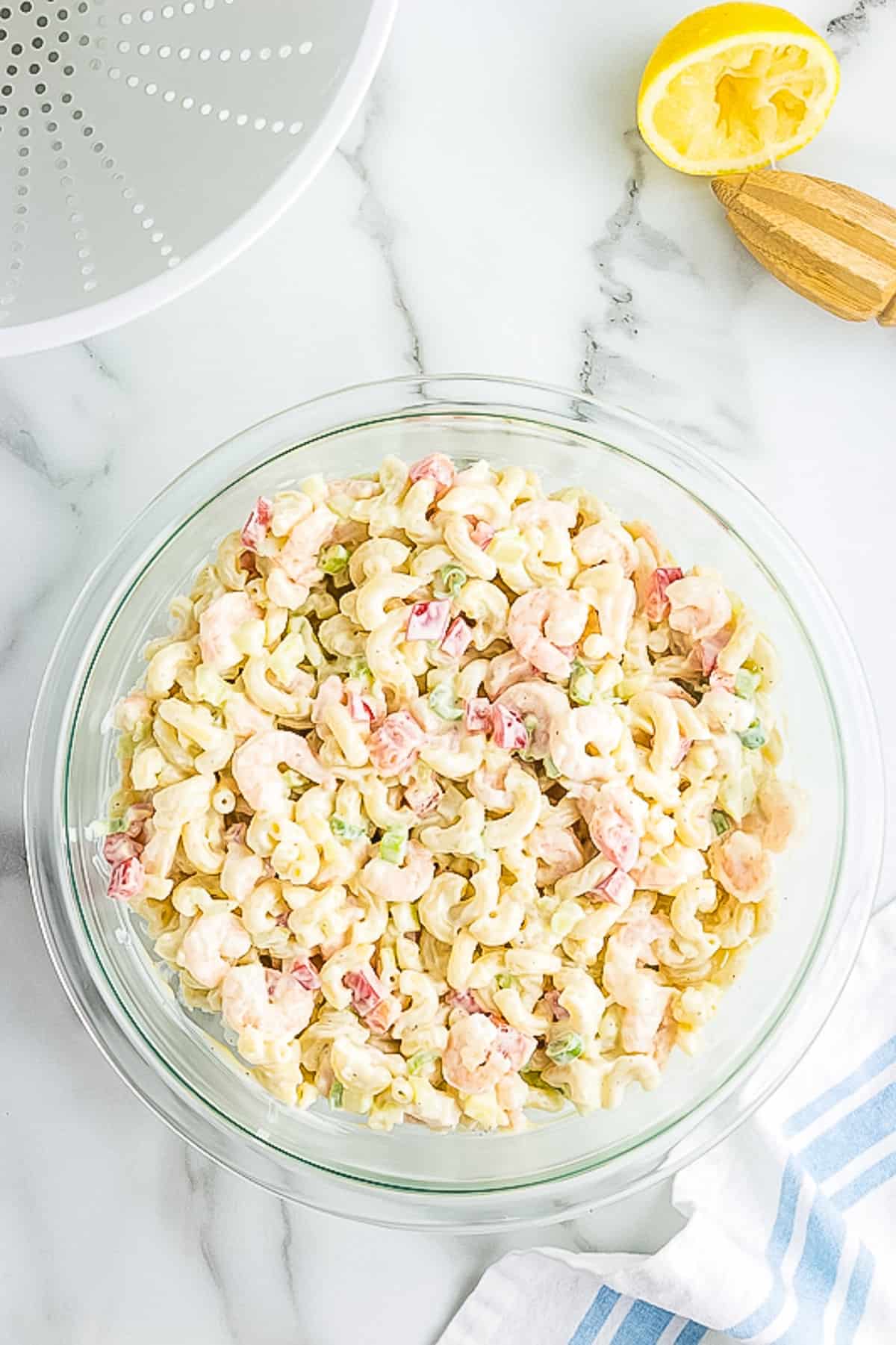 Glass bowl with pasta salad with shrimp