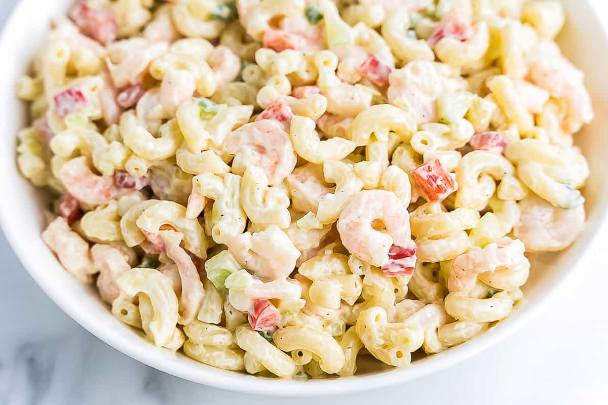 pasta salad with shrimp in white bowl