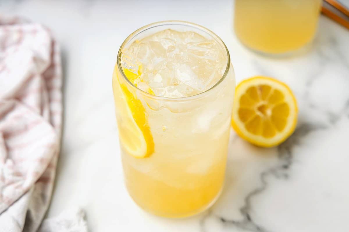 Glass with lemon slice and Spiked Lemonade