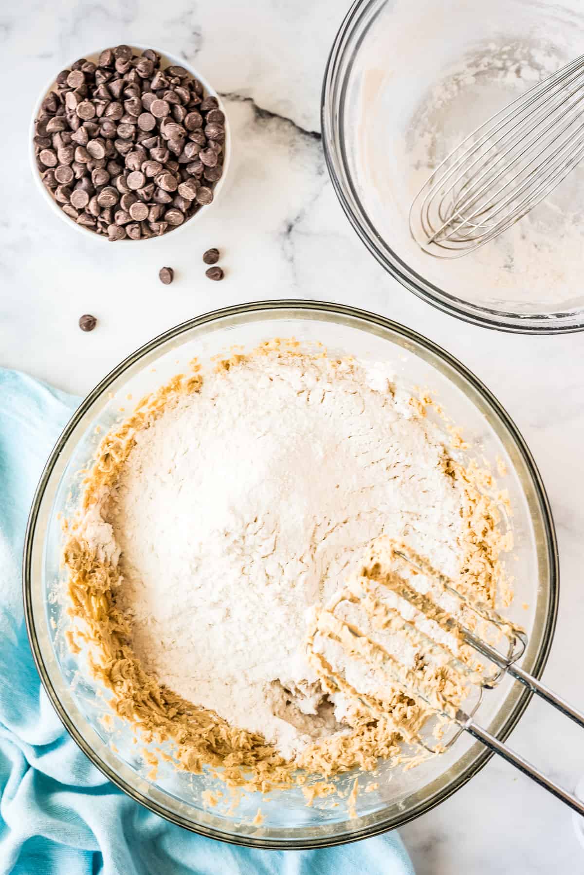 Mixing flour into cookie batter in bowl