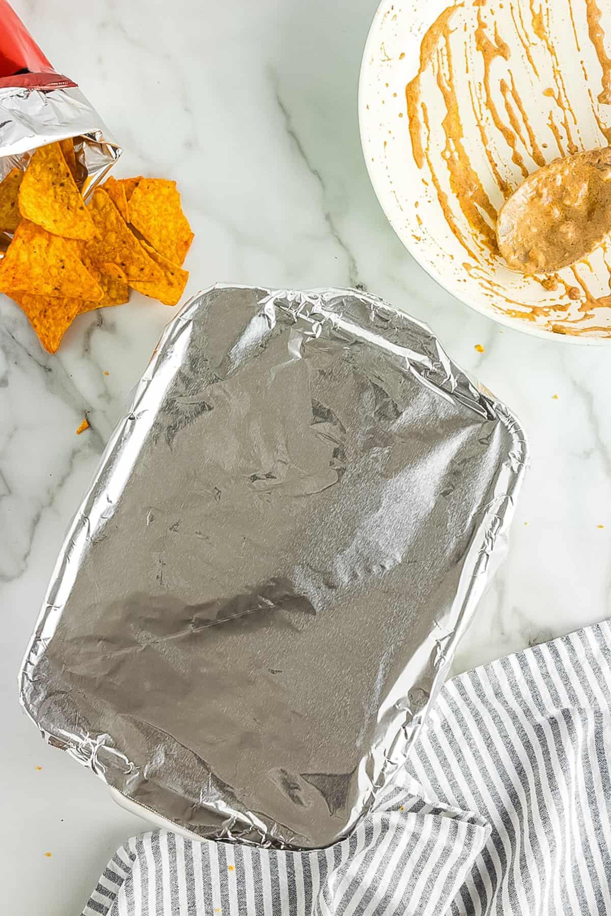 Casserole dish with aluminum foil covering it