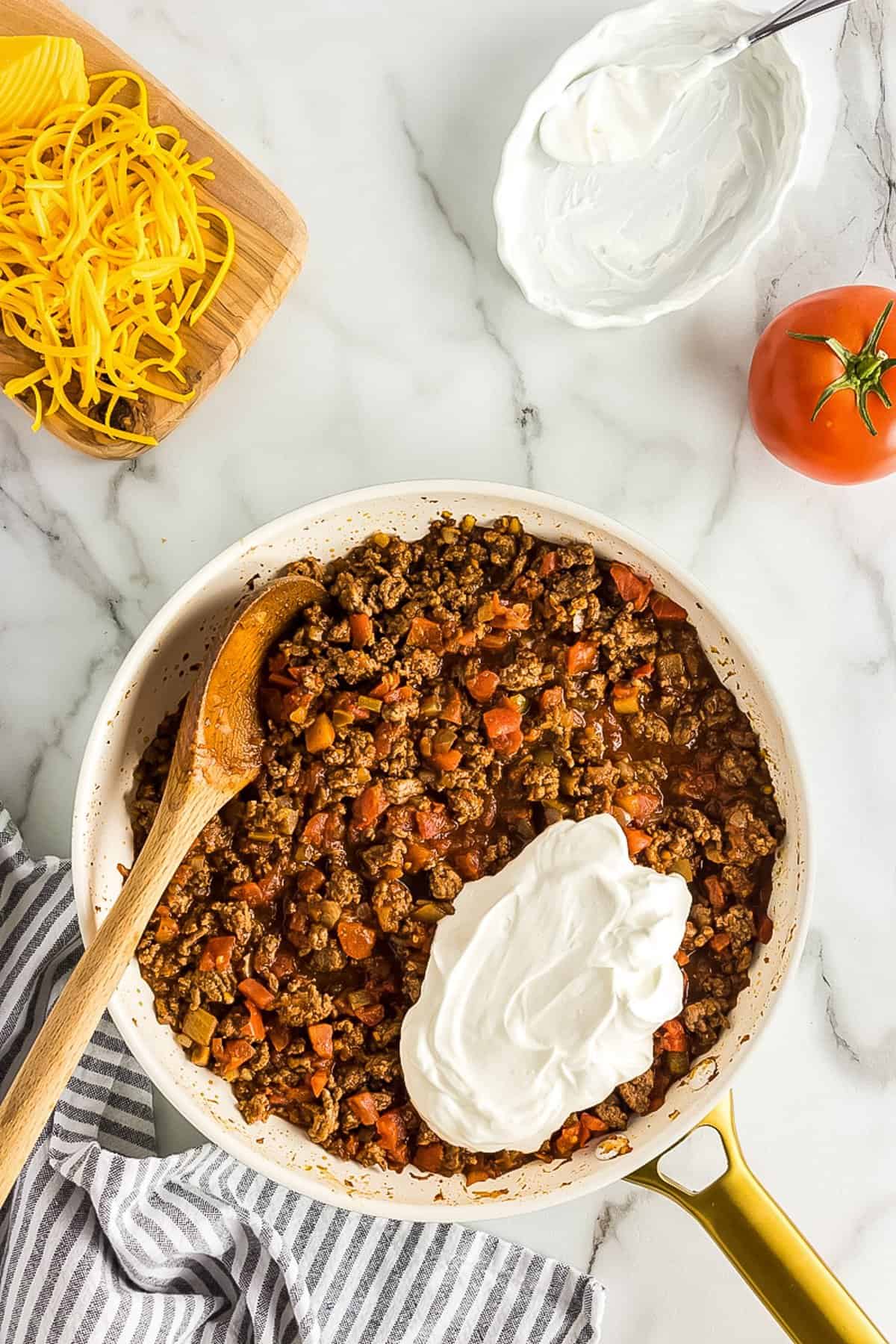Taco Meat in skillet with sour cream