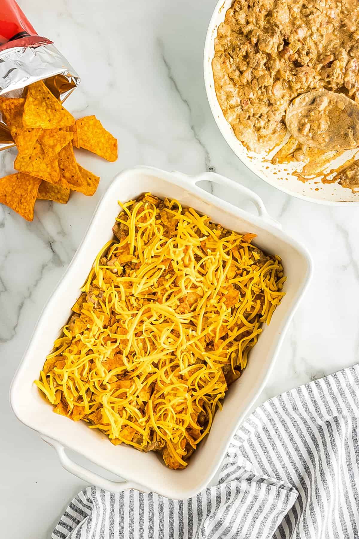 Grated cheese on top of casserole dish baking dish