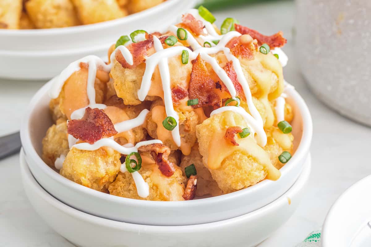 White bowl with loaded tater tots