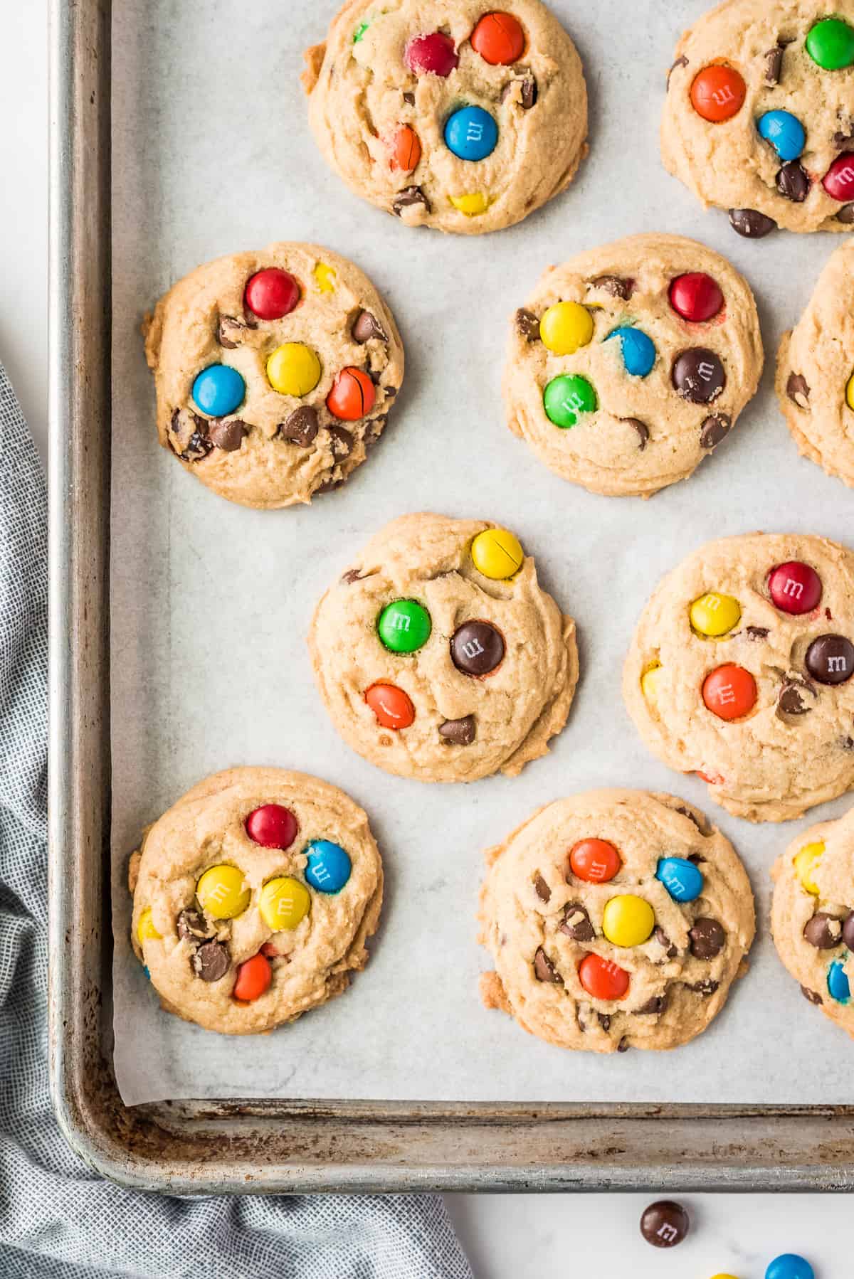 Overhead Image of baked M&M cookies on baking sheet