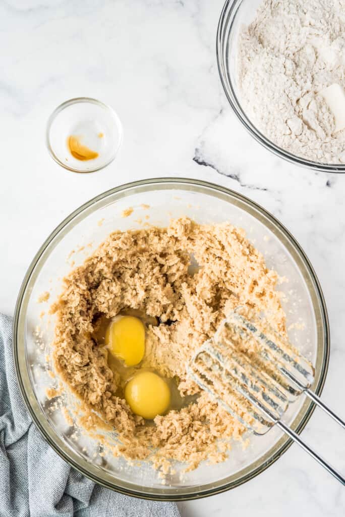 Cookie dough with eggs in mixing bowl