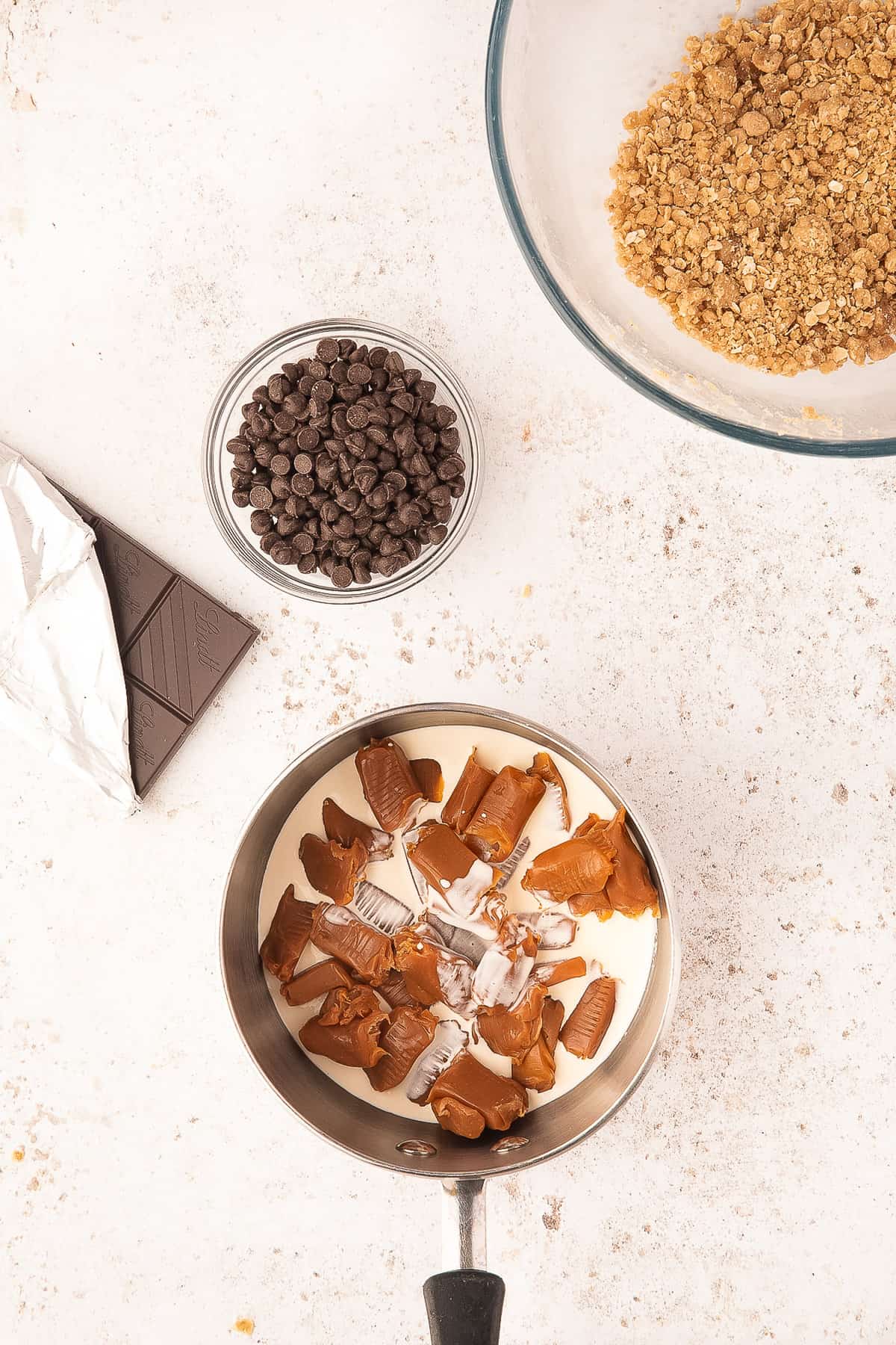 Saucepan with caramels and heavy cream