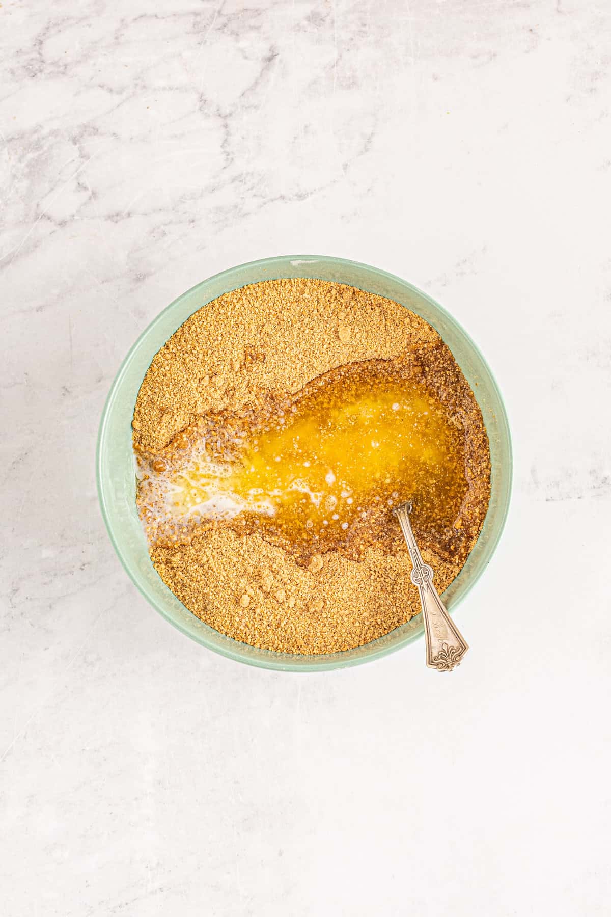 Mixing ingredients for graham cracker crust