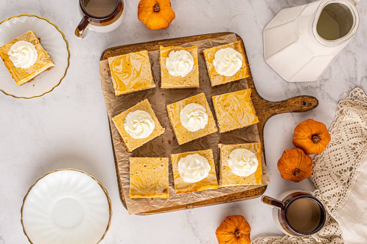 Overhead image of pieces of pumpkin cheesecake bars