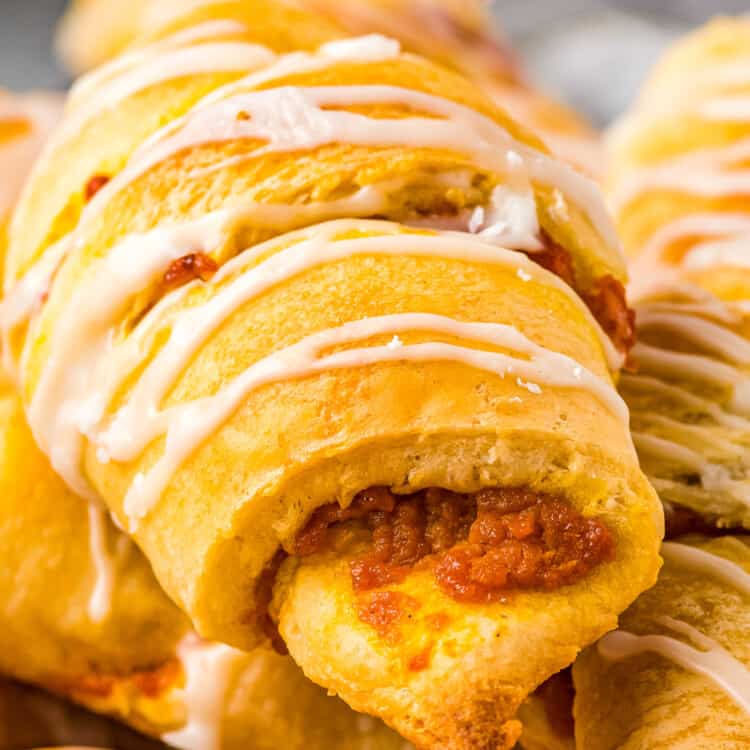 Close up of pumpkin crescent roll with glaze