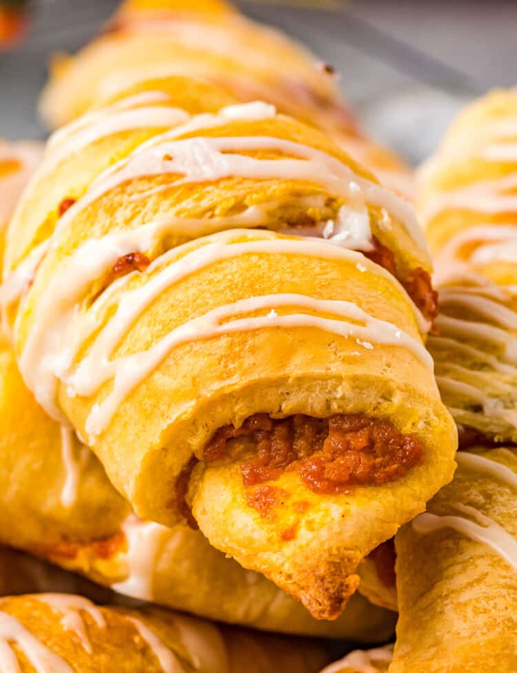 Close up of pumpkin crescent roll with glaze