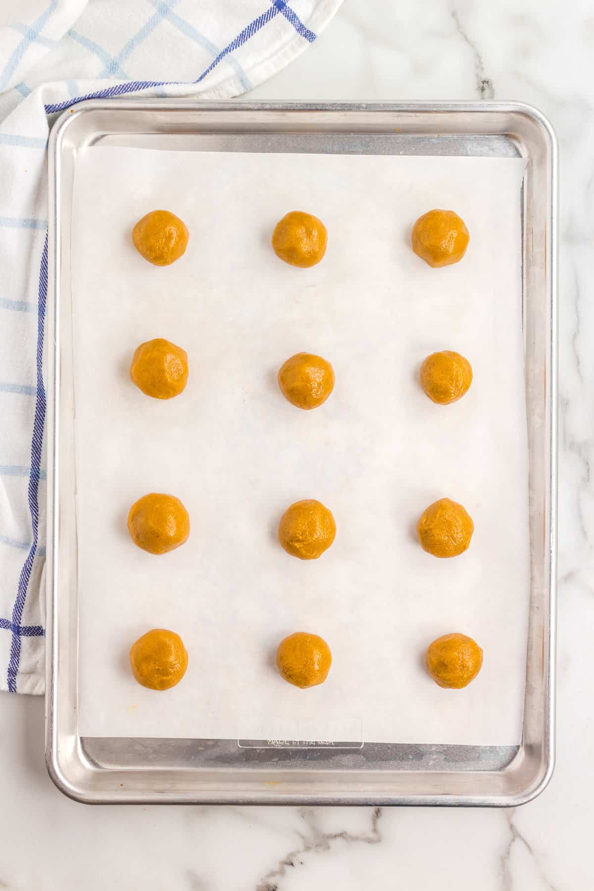 Peanut Butter Cookie Dough balls on sheet pan