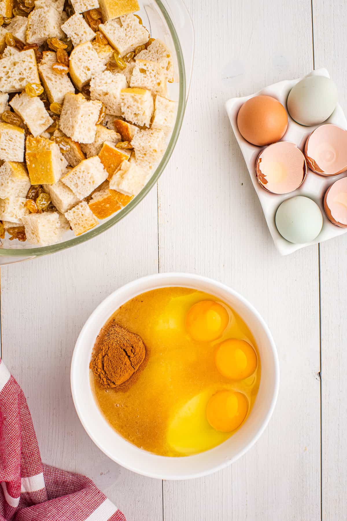 Bowl with eggs, sugar and spices in it before whisking