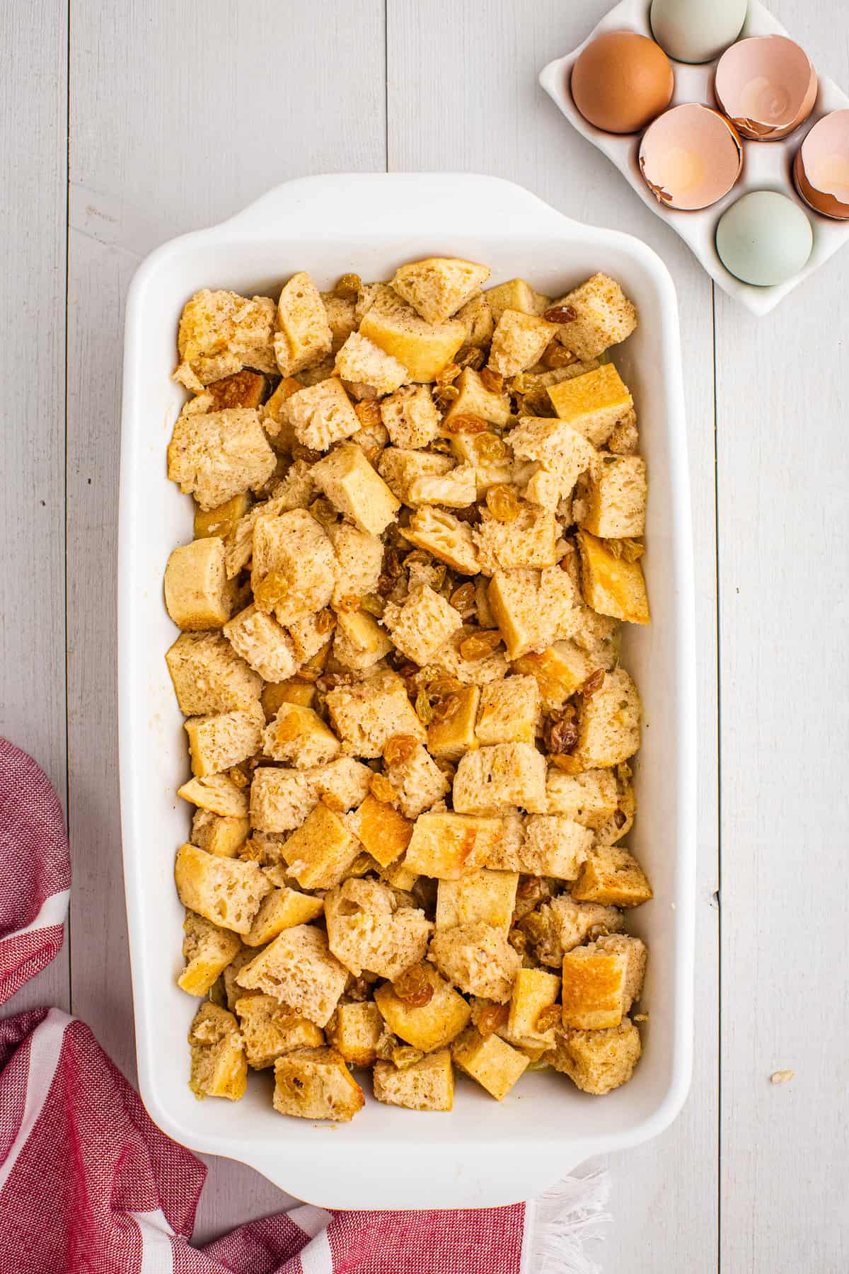 Overhead image of bread pudding in casserole dish before baking