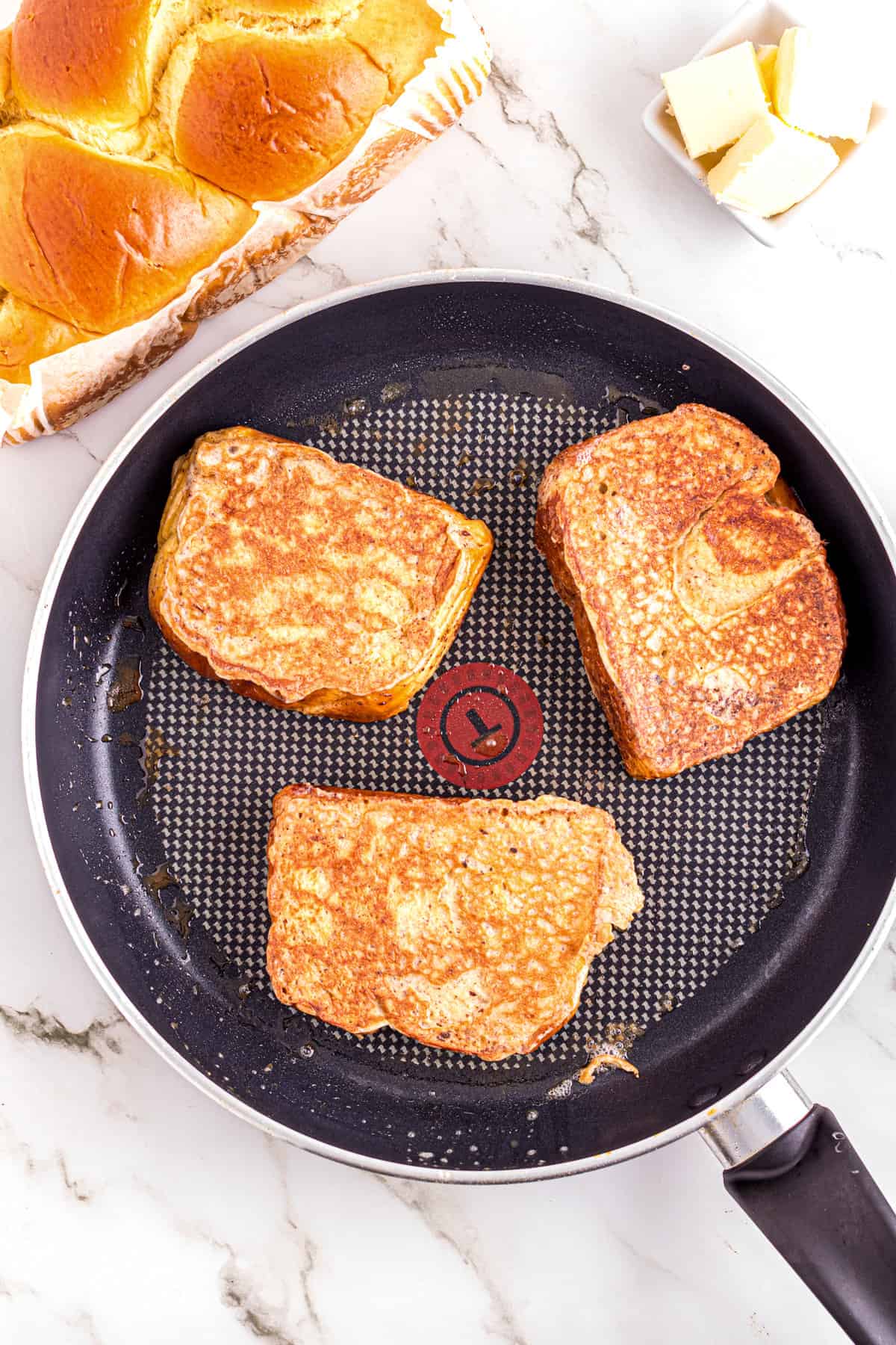 Skillet with three pieces of French Toast