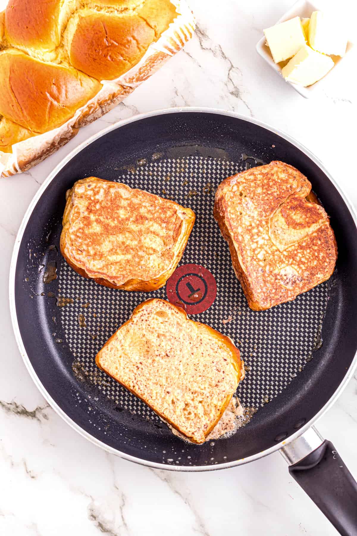 Skillet with Brioche French Toast in it