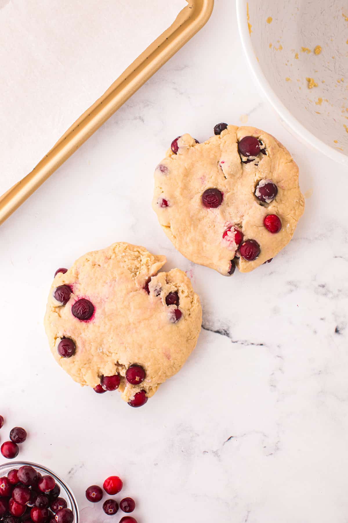 Two round dough balls of cranberry scones