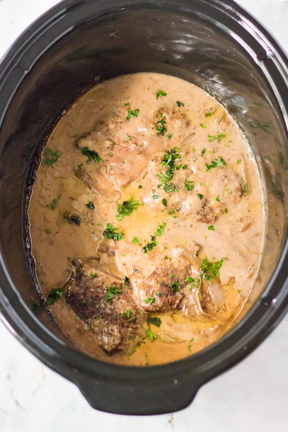Slow cooker with cube steak and gravy