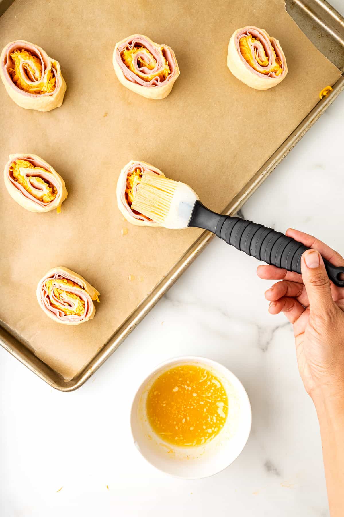 Brush crescent pinwheels with garlic butter