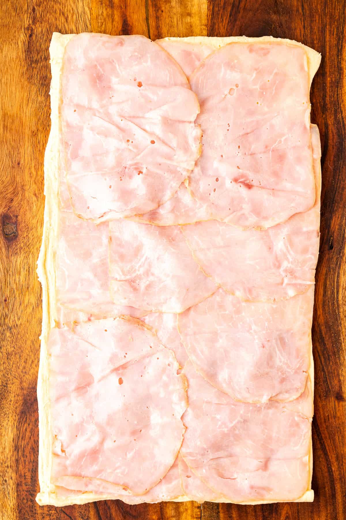 Ham slices on crescent dough roll