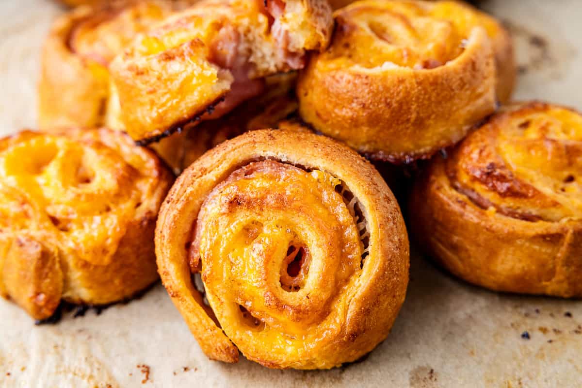 Stack of baked ham and cheese pinwheels