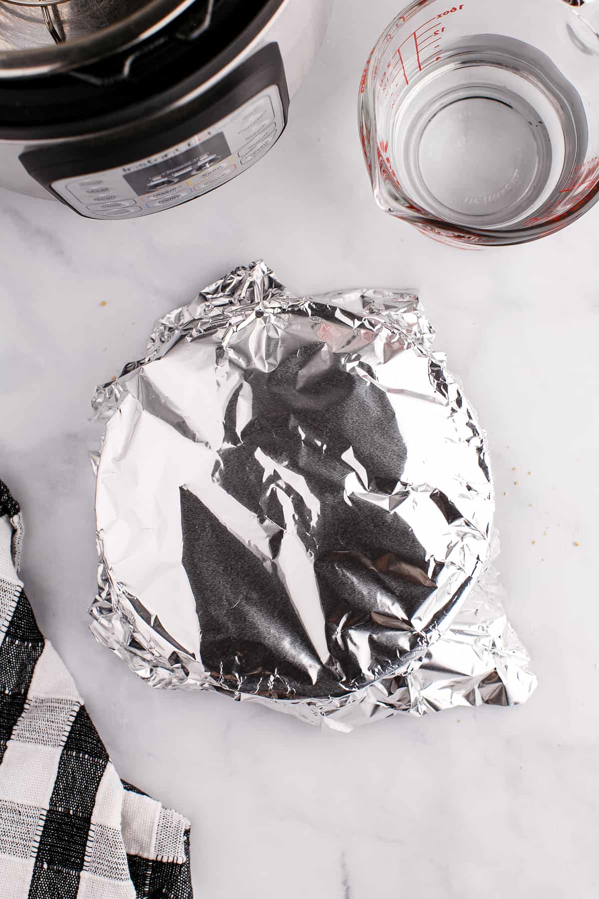 Springform pan covered in aluminum foil
