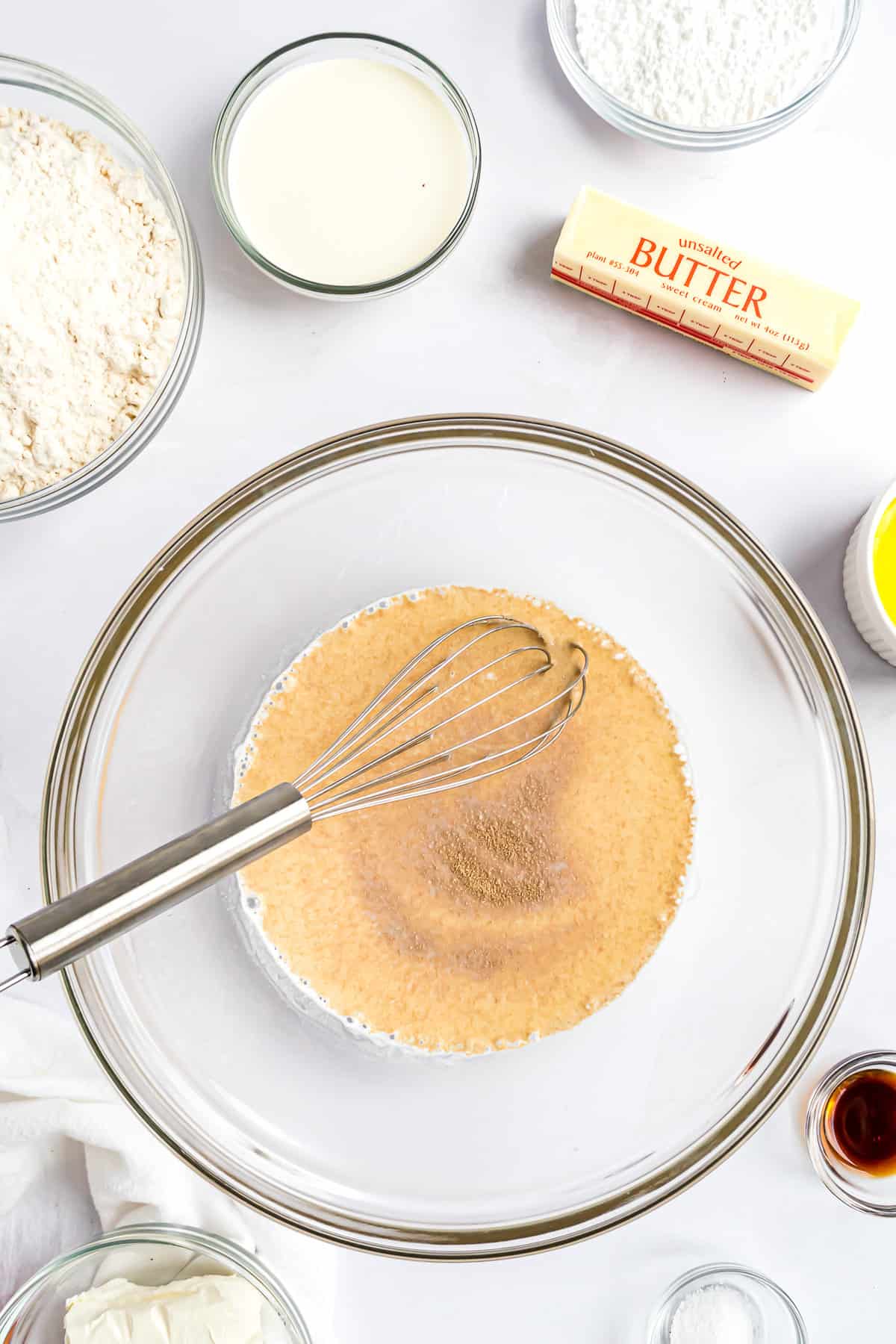 Warm milk and yeast in bowl