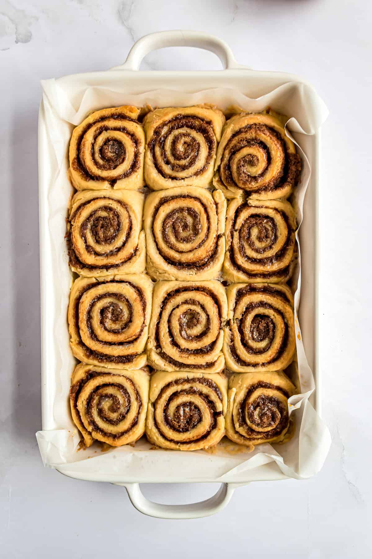 Overhead image of cinnamon rolls in pan