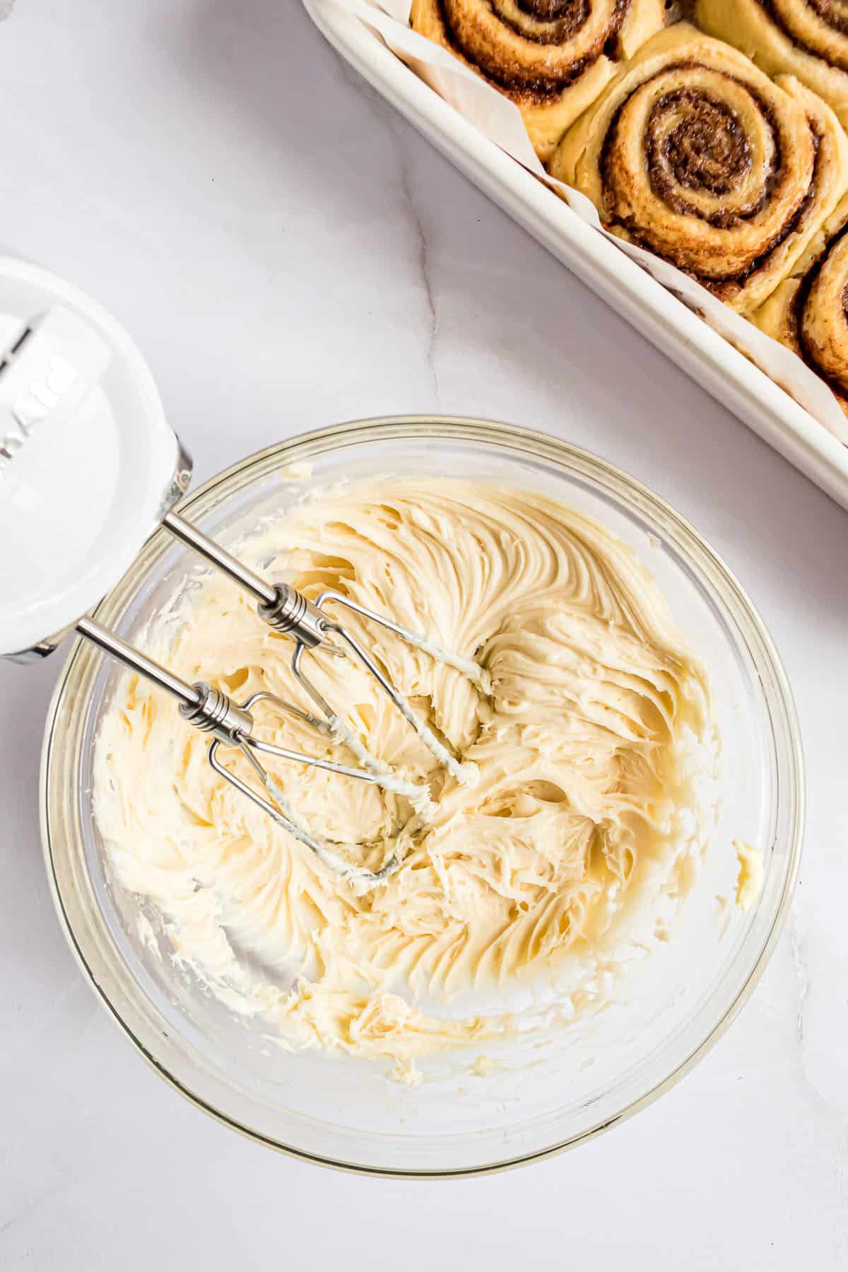 Bowl with cream cheese cinnamon roll frosting