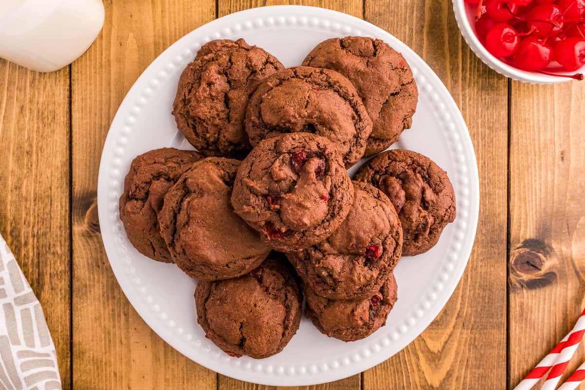 Overhead image of white plate with chocolate cherry cookies