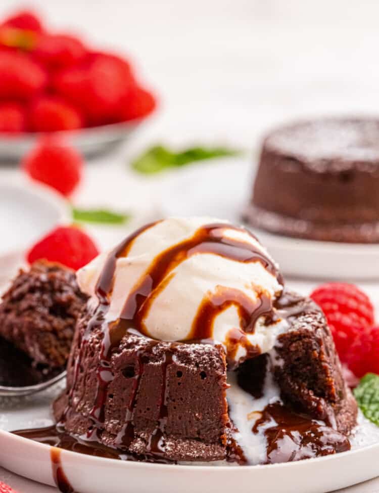 Chocolate Lava Cake topped with ice cream and chocolate syrup