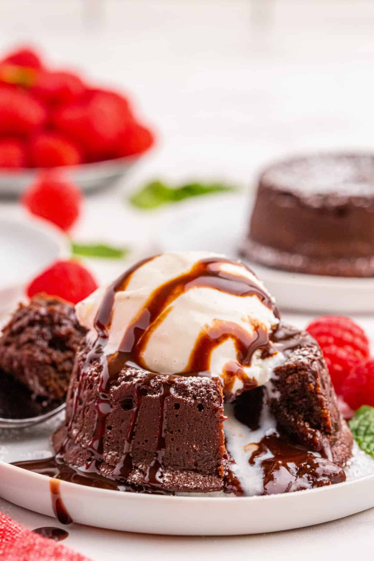 Chocolate Lava Cake topped with ice cream and chocolate syrup