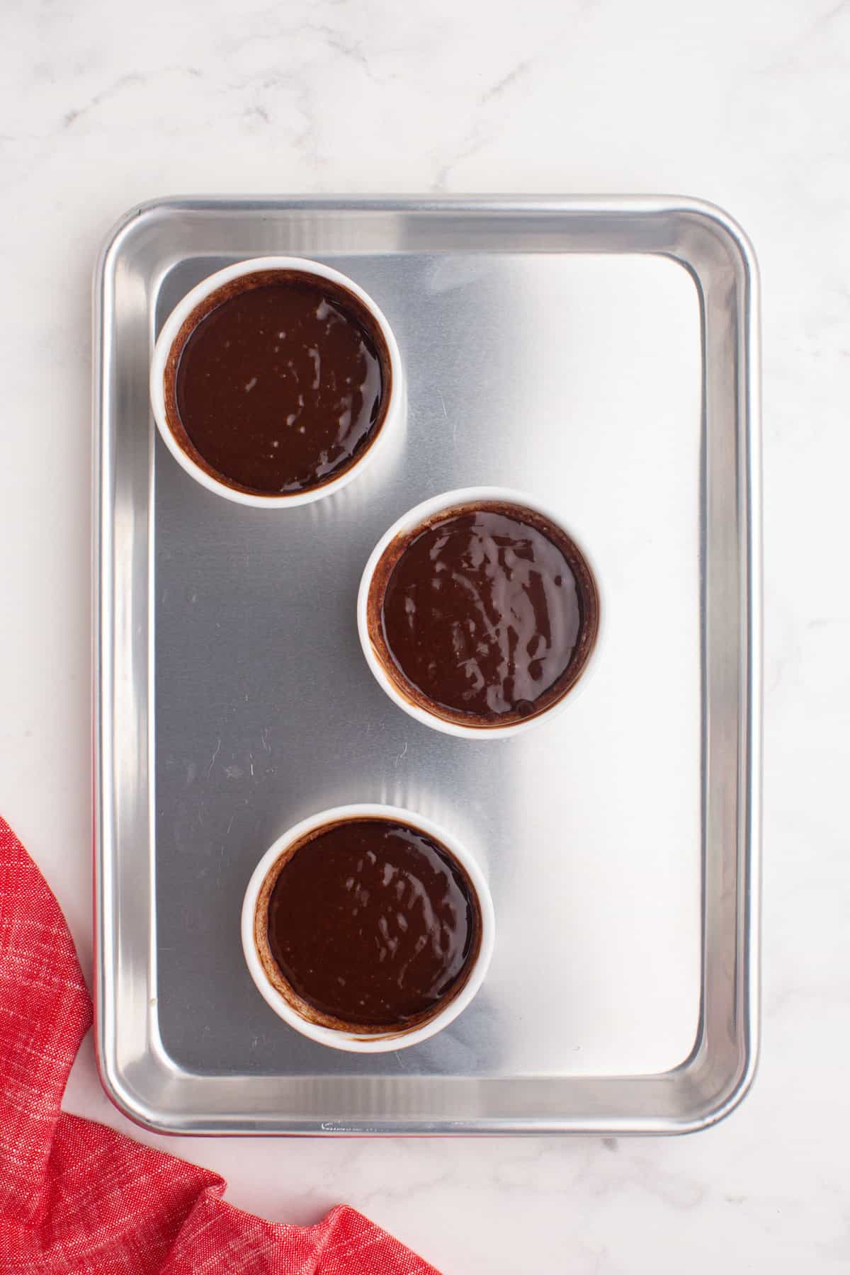 Ramekin with lava cake batter in them