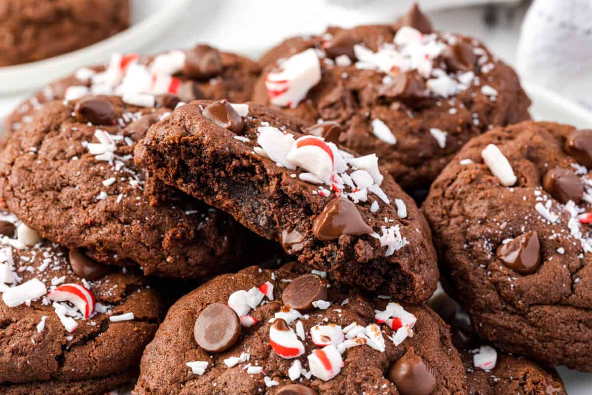 Chocolate Peppermint Cookies stacked with top one bite out of it