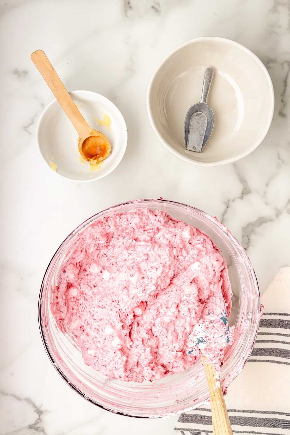 Cranberry fluff mixed in glass bowl