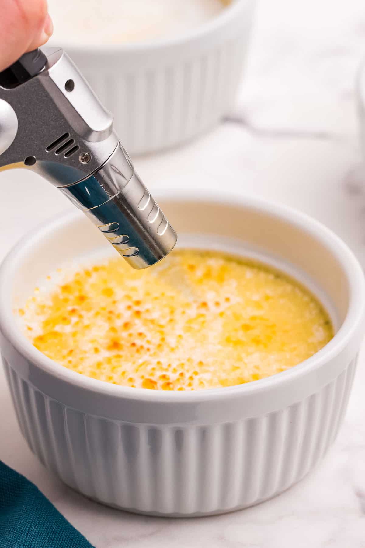 Torching creme brulee in ramekin