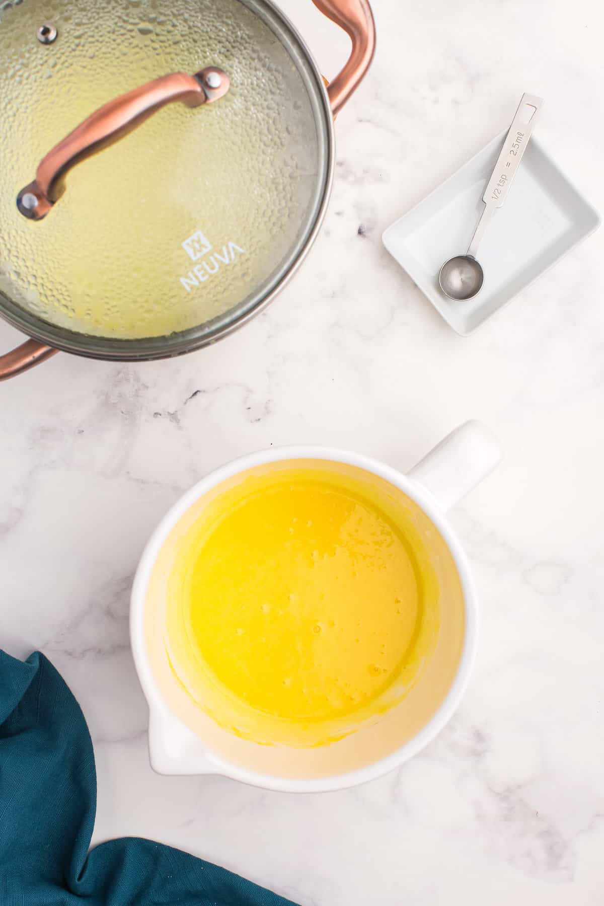 Bowl with whisked egg yolks and cream