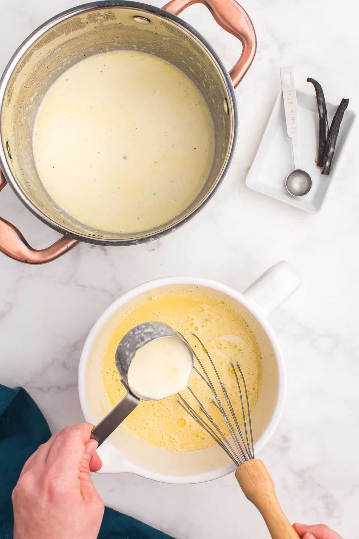 Pouring cream mixture into sugar mixture