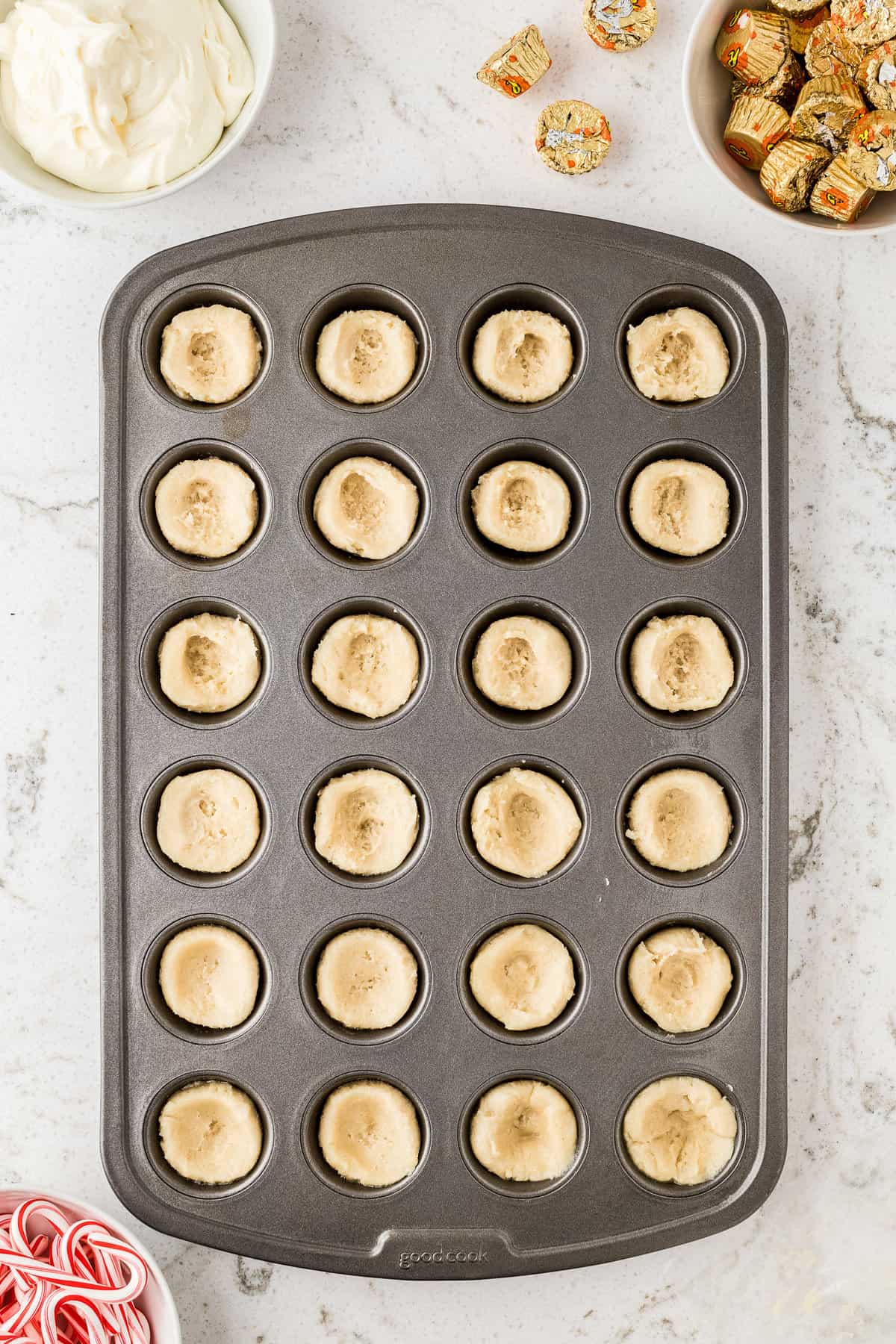 Mini muffin pan with raw sugar cookie dough