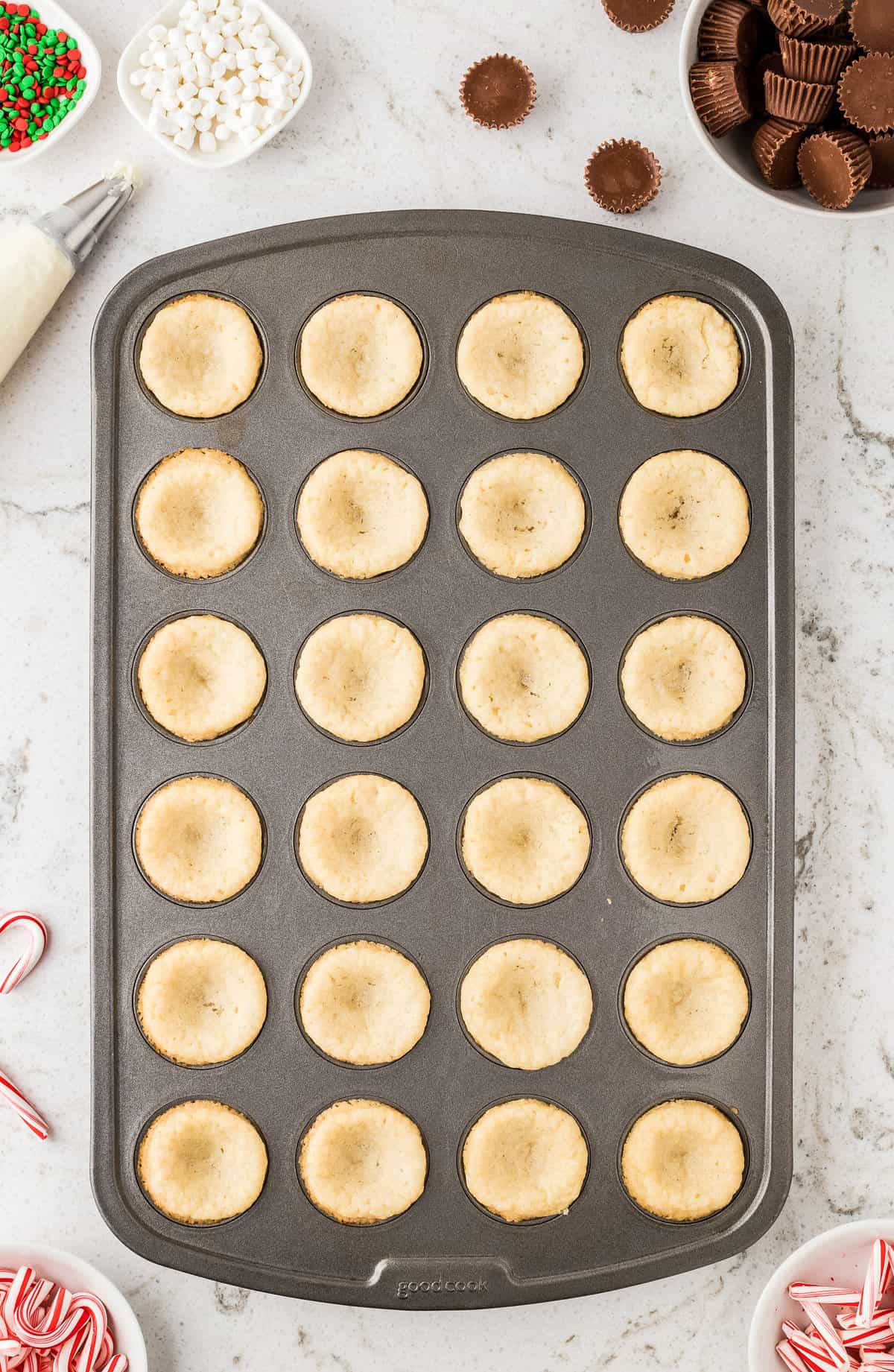 Sugar cookie dough in mini muffin pan