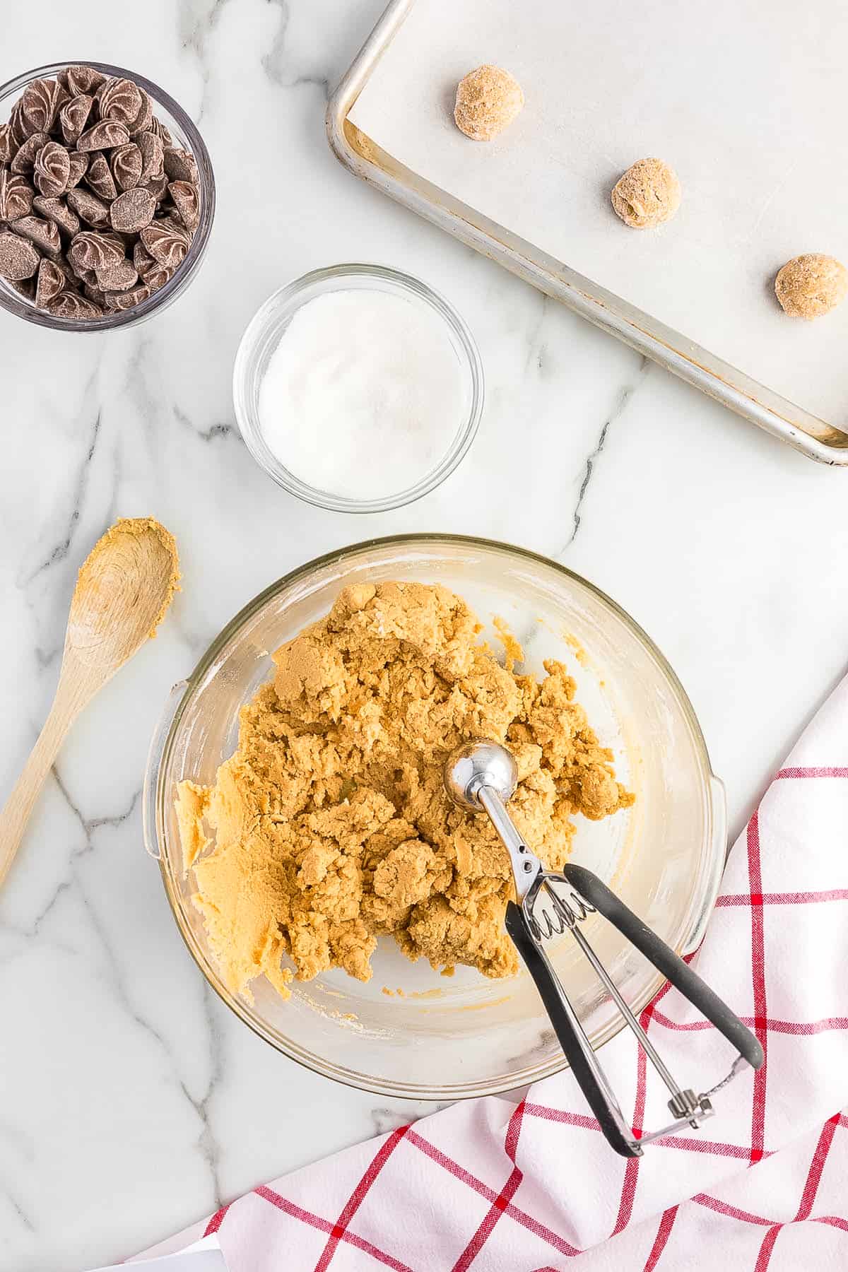 Overhead image of peanut butter cookie dough in glass bowl