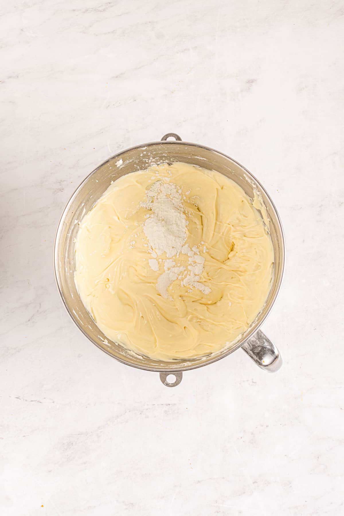 Cheesecake filling in mixing bowl with cornstarch