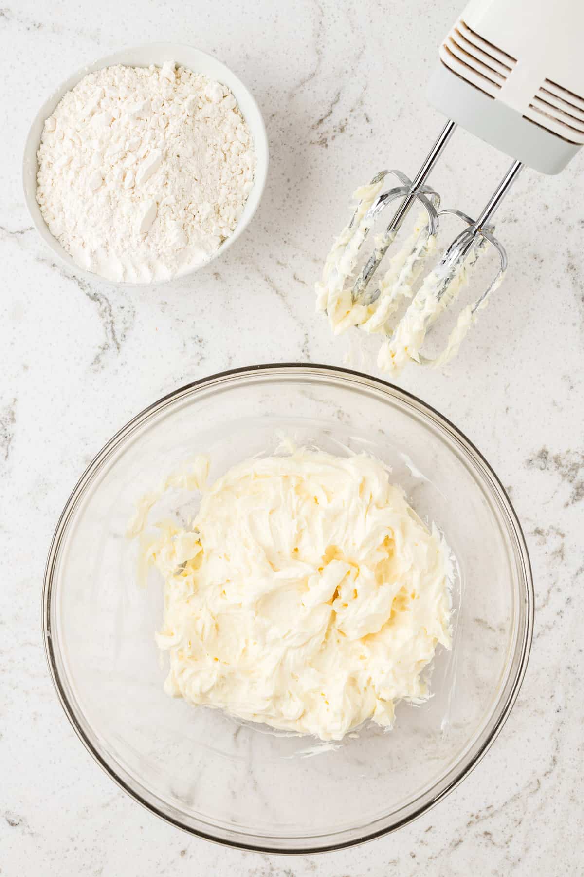 Creaming cream cheese and butter in bowl