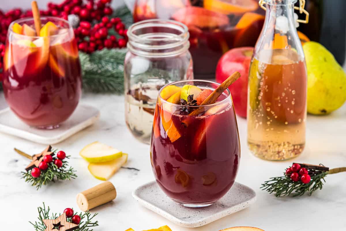 Glass and pitcher with Christmas red sangria